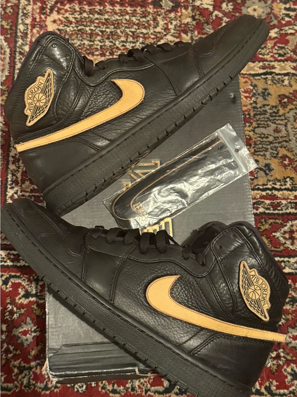 Jordan 1 Retro BHM - Men's High Top Sneakers in Black with Gold Swoosh
